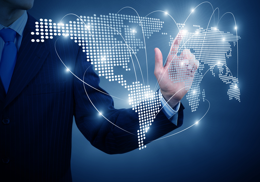 Business professional interacting with a digital global network.